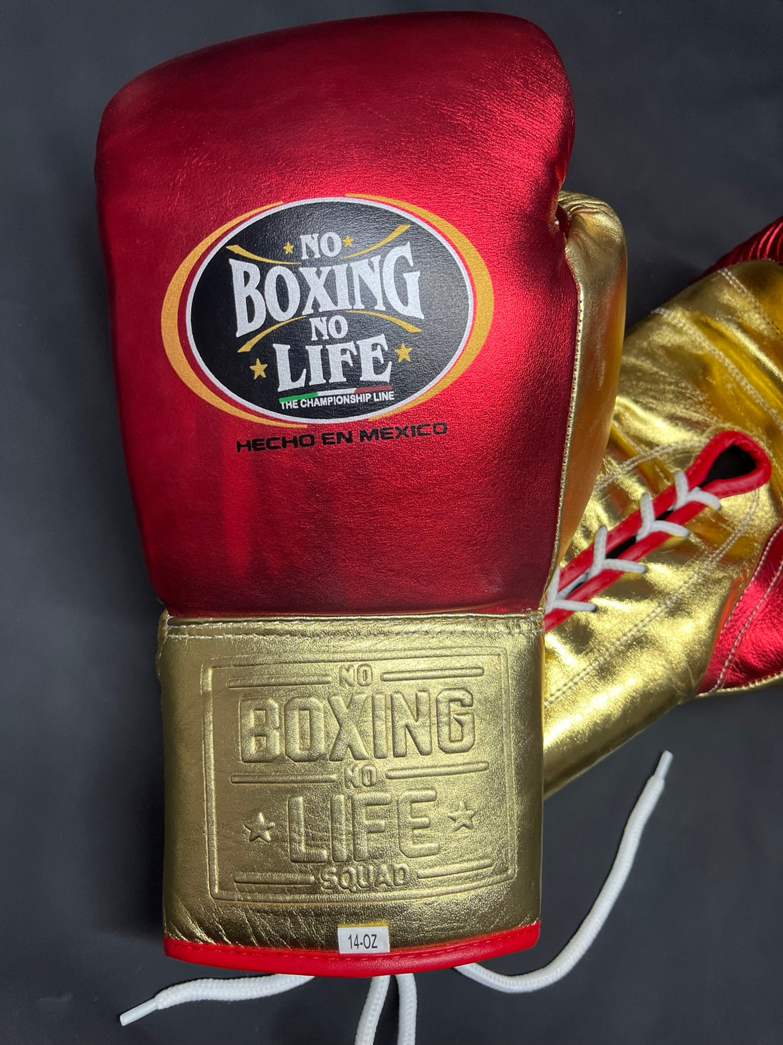 Close-up of No Boxing No Life red and gold boxing glove