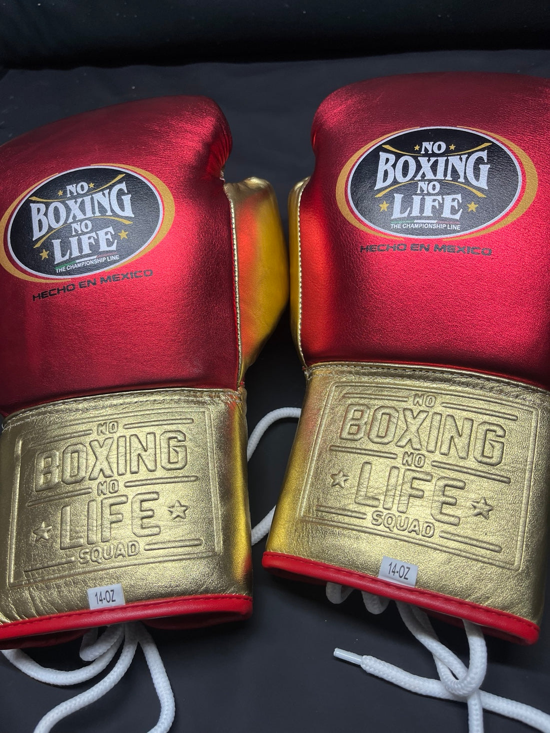 Pair of No Boxing No Life red and gold lace-up boxing gloves