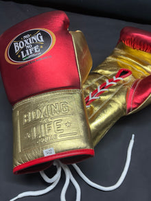 Angled view of No Boxing No Life red and gold boxing gloves