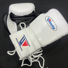 White and black Winning lace-up boxing gloves angled view