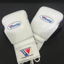 White and black Winning lace-up boxing gloves pair