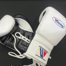 White and black Winning lace-up boxing gloves side view