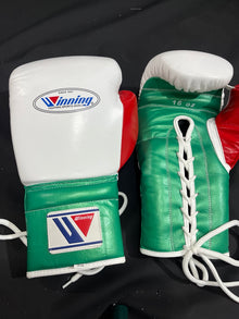 Winning white green and red lace-up boxing gloves wrist and lacing detail view