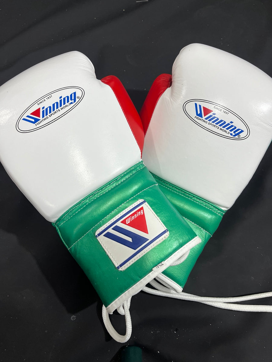 Winning white green and red lace-up boxing gloves front pair view