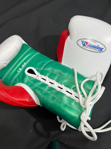 Winning white green and red lace-up boxing gloves palm and lacing view