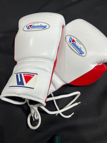 Winning white and red lace-up boxing gloves front pair view