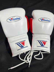 Pair of Winning white and red lace-up boxing gloves