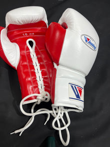 Winning white and red 16 oz lace-up boxing gloves palm and lacing view